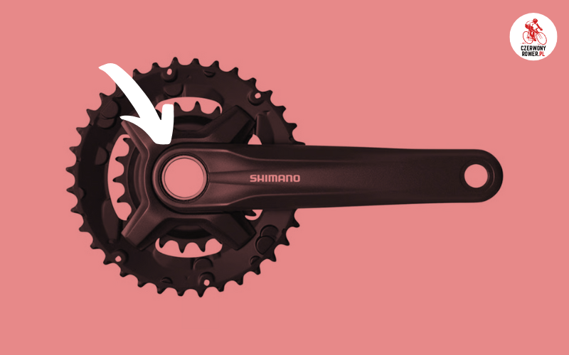 Mechanizm korby Shimano z systemem Hollowtech II z charakterystycznym otworem na wylot w ramieniu.